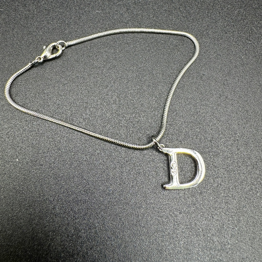 LOT 1478 rhodium plated Christian Dior bracelet Dior charm